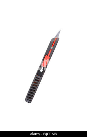 an old used black scalpel, isolated on white. Stock Photo