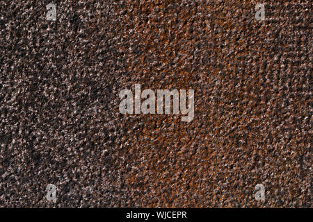 hammered granite background in black and red. Stock Photo