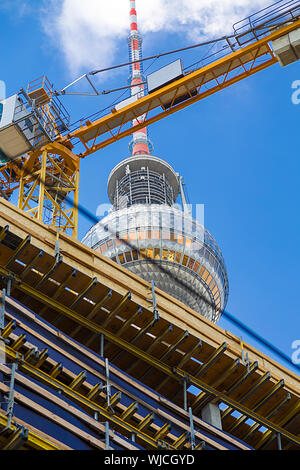 top of the berlin tv tower seen through a construction site. Stock Photo