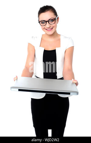 Corporate lady showing laptop to camera Stock Photo