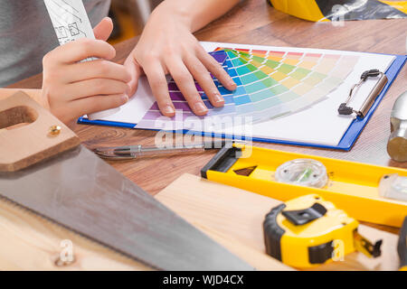 hands of wemale on color palette Stock Photo