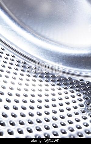 washing machine drum background with copyspace showing household concept Stock Photo