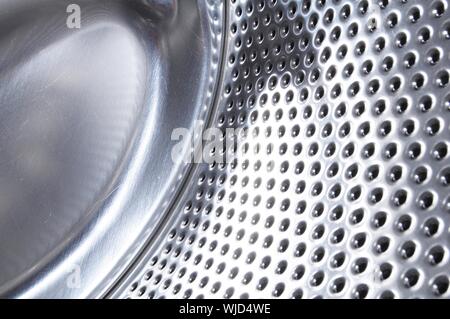 washing machine drum background with copyspace showing household concept Stock Photo