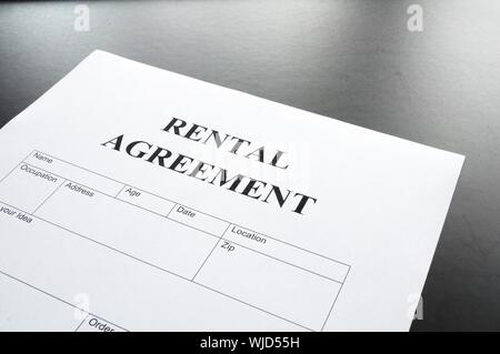 rental agreement form on desktop in business office showing real estate concept Stock Photo