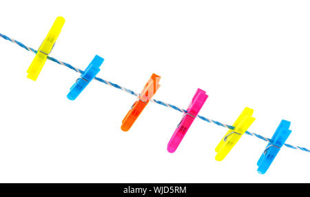 Colorful clothes pins on a laundry rope Stock Photo