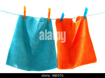 Colorful clothes pins on a laundry rope Stock Photo