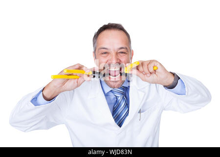 Smiling Male Doctor Holding Pliers On White Background Stock Photo