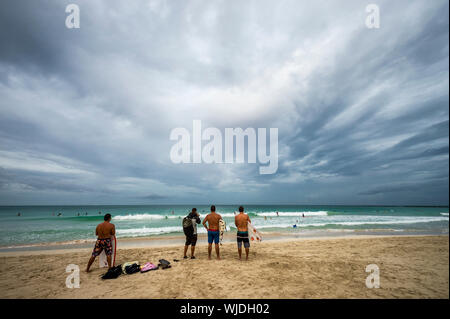 MIAMI - SEPTEMBER 02, 2019: Surfers on South Beach take advantage of storm swells from Hurricane Dorian on Labor Day. Stock Photo