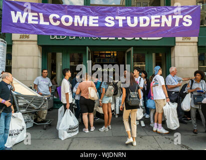 Hundreds of NYU students, some with their families, descend on Bed Bath and Beyond in the Ladies Mile shopping district in New York on Sunday, August 25, 2019 to shop to furnish their dorm rooms at the university. Besides getting a discount the students where shepherded back and forth from their dorms via buses rented for the occasion by Bed Bath and Beyond and were assisted with their purchases by Bed Bath and Beyond employees.  (© Richard B. Levine) Stock Photo