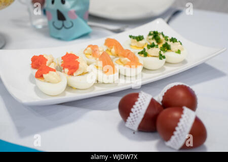Traditional, polish Easter table with colored eggs, boiled eggs Stock Photo