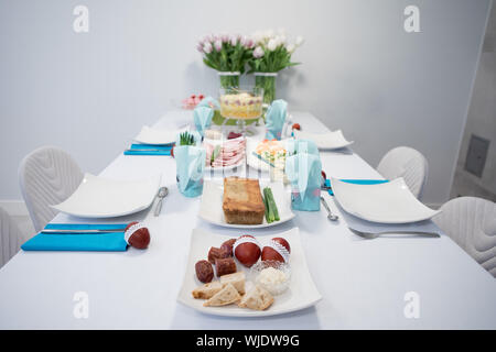 Traditional, polish Easter table with colored eggs, boiled eggs Stock Photo