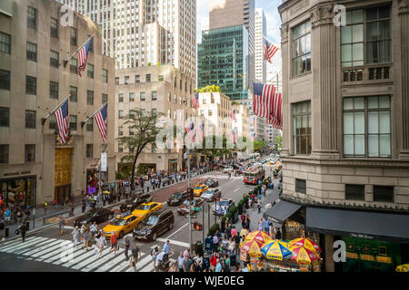 Fifth Avenue in New York, with Rockefeller Center, left and Saks Fifth avenue, right, on Saturday, August 31, 2019. (© Richard B. Levine) Stock Photo