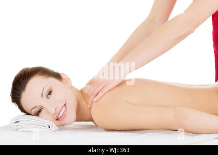 Preaty woman relaxing beeing massaged in spa saloon Stock Photo