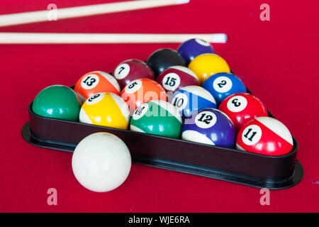 Pool billiards on red table to play Stock Photo