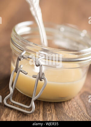 close up of a bottle of sweetened condensed milk Stock Photo