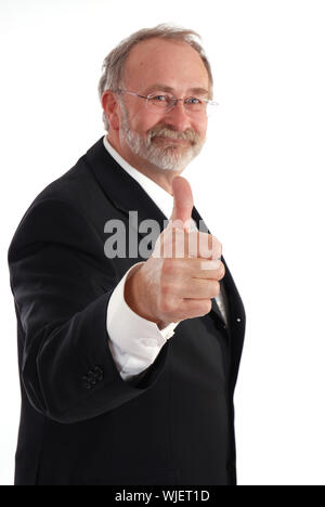 Senior businessman giving the thumbs up. Stock Photo