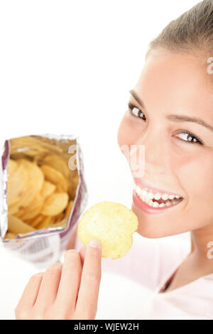 Woman eating chips Stock Photo
