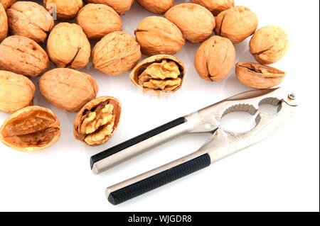 Several open and closed walnuts isolated over white Stock Photo
