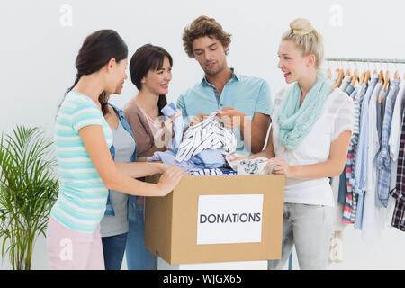 Group of young people with clothes donation Stock Photo