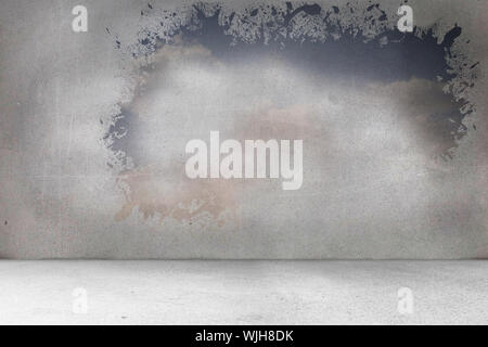 Splash on wall revealing bright sky Stock Photo