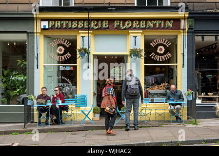 Customers sitting outside Patisserie Florentin in Stockbridge, Edinburgh, Scotland, UK. Stock Photo