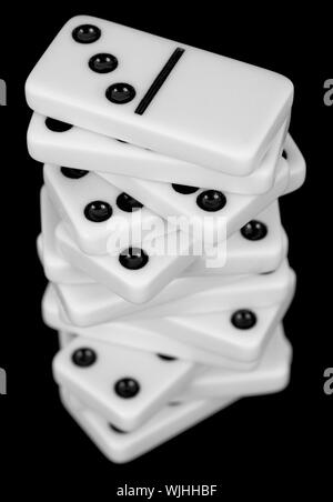 Pile from dominoes isolated on a black background Stock Photo