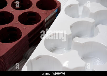 Plastic containers for flower pots in brown and white Stock Photo