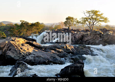 Ruacana Falls on the border of Namibia and Angola at sunrise. Stock Photo