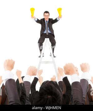 success businessman using cheer megaphone celebrating with team Stock Photo