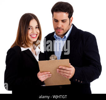 Front view of male and female colleagues holding notepad and discussing against white isolated background Stock Photo
