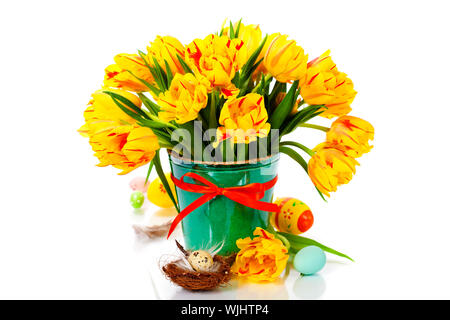spring tulips with easter eggs on white background Stock Photo