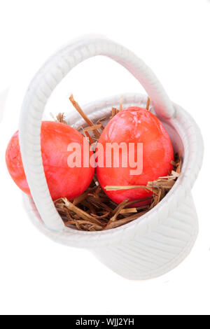 Basket of brightly coloured Easter Eggs Stock Photo