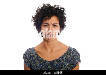 portrait of hispanic woman looking at camera upset and sad. Isolated on white background Stock Photo