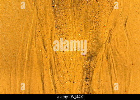 Close-up of sand with tidal ways and shells on the beach, full frame texture Stock Photo