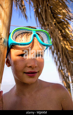 Little Boy In Swimming Pool Wearing Goggles High-Res Stock 