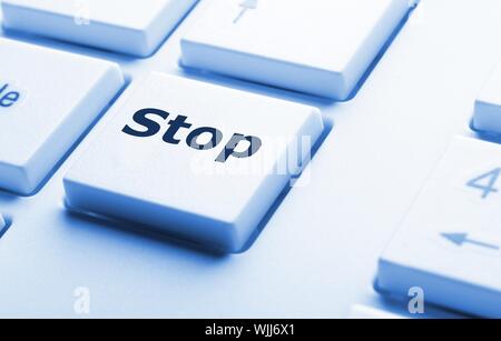 stop key on keyboard in red showing halt concept Stock Photo