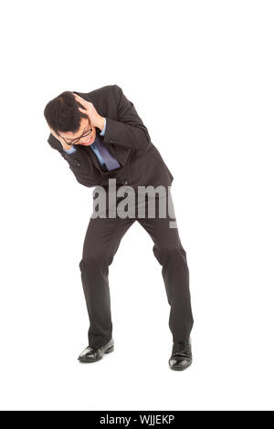 Businessmen scared to hands over his ears Stock Photo