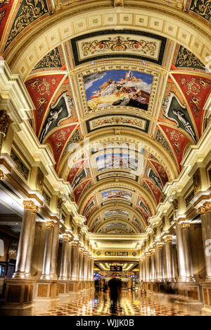 Beautiful corridor with golden decoration and painting on ceiling in luxury hotel in Macao, China. Stock Photo