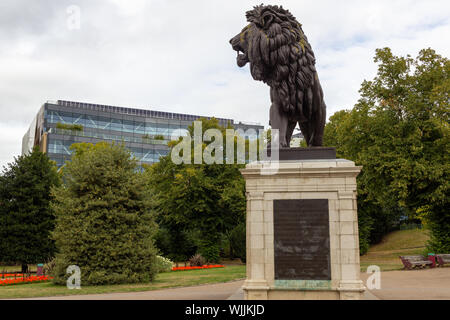 The Maiwand Lion and Forbury Gardens, Reading, Berkshire, with modern office buildings in background Stock Photo