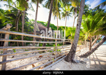 Abandoned and deserted hotel in the jungle on white beach Stock Photo