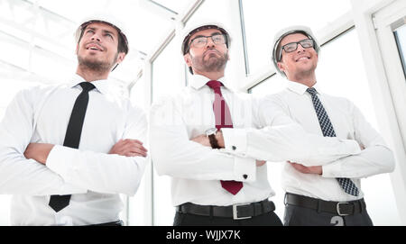 three architects standing in an empty office Stock Photo
