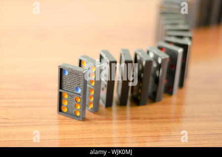 black domino on wooden background Stock Photo