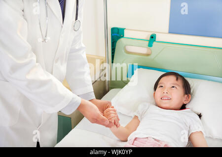 Doctor examining a child patient by stethoscope Stock 