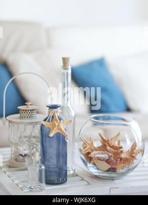 Idea of interior decoration with starfishes and glass bottles Stock Photo