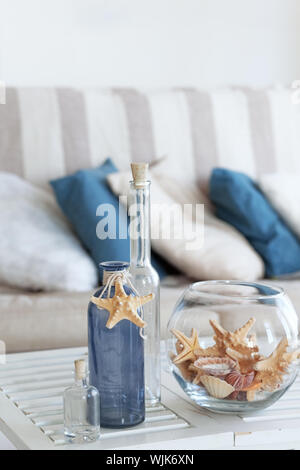 Idea of interior decoration with starfishes and glass bottles Stock Photo