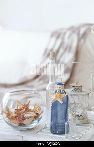 Idea of interior decoration with starfishes and glass bottles Stock Photo