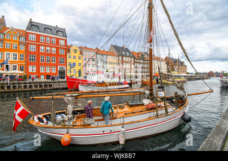 nyhavn copenhagen denmark danish flag alamy dock sailboat senior woman man