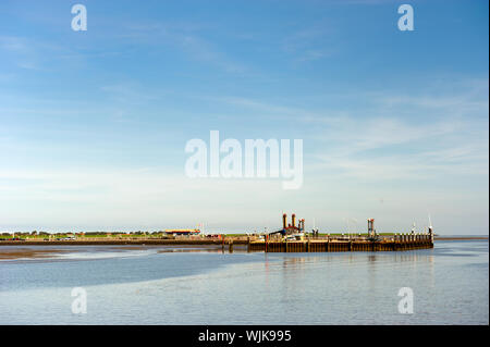 Pier for boat arrivals at the Dutch island Ameland Stock Photo