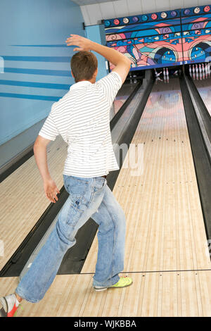 Young Man Bowling Stock Photo