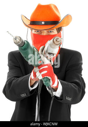 man in corporate suit and cowboy hat with electric drills Stock Photo